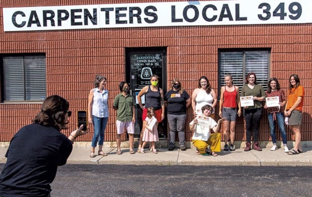 Graduates and staff from the Vermont Works for Women Trailblazers program posing for a photo after a graduation ceremony - GLENN RUSSELL