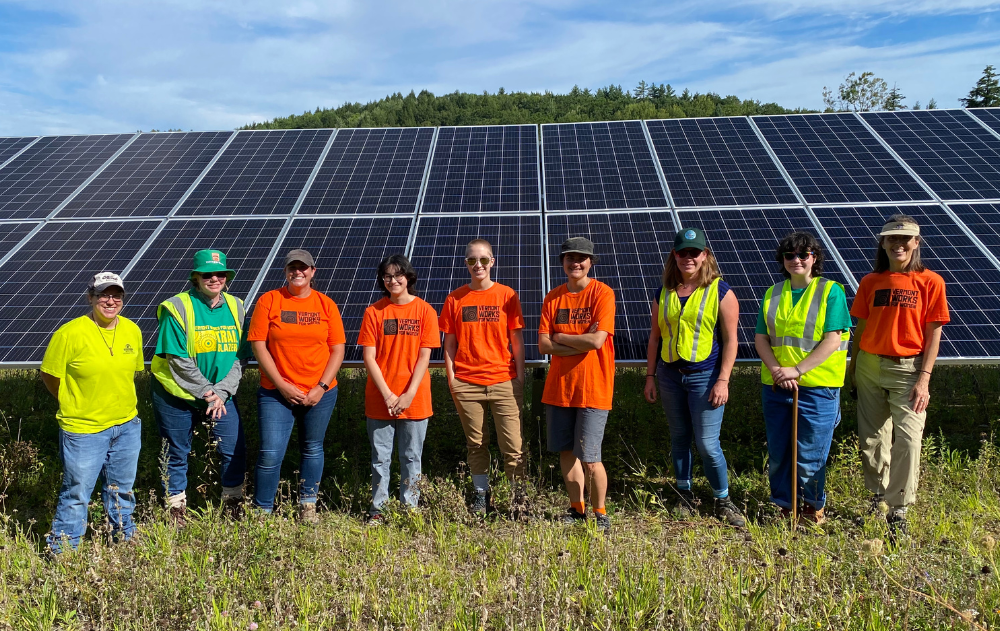 Trailblazers: Green class stands in front of solar panels