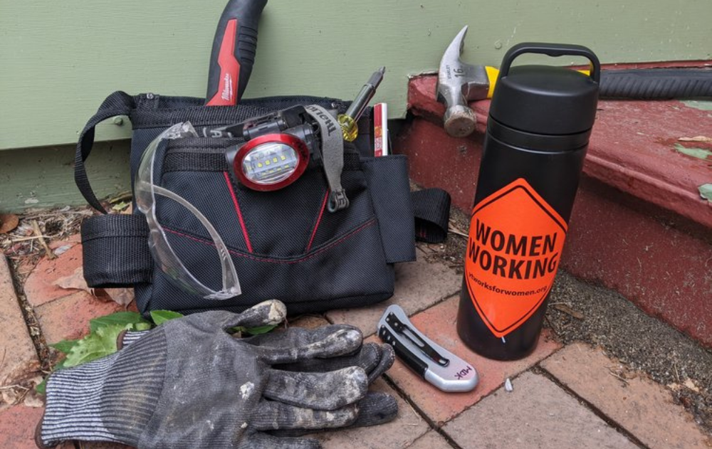 Trailblazers: Green participant's tool bag, hammer, gloves, and water bottle.