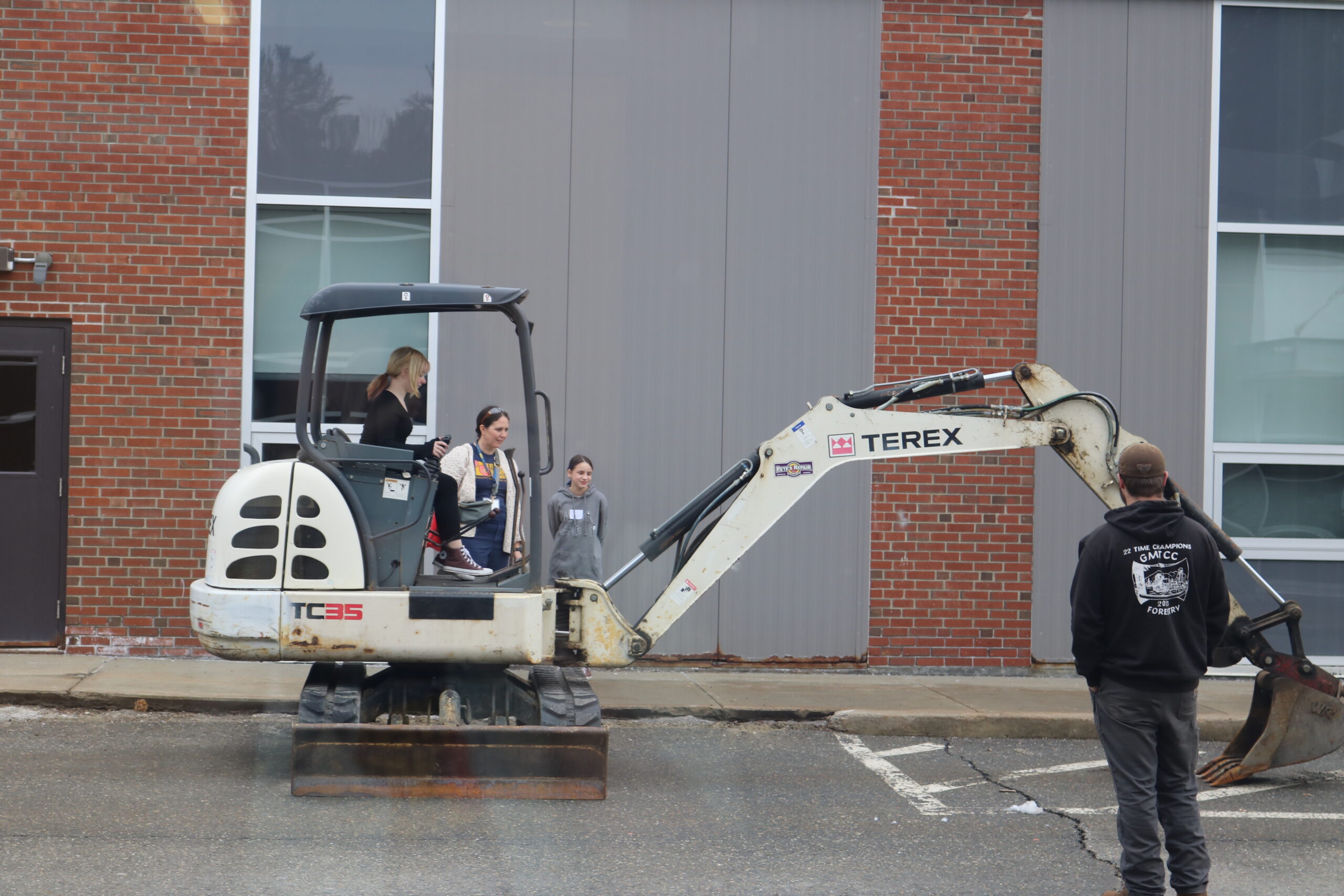 Middle school student operates excavator at Career Challenge Day