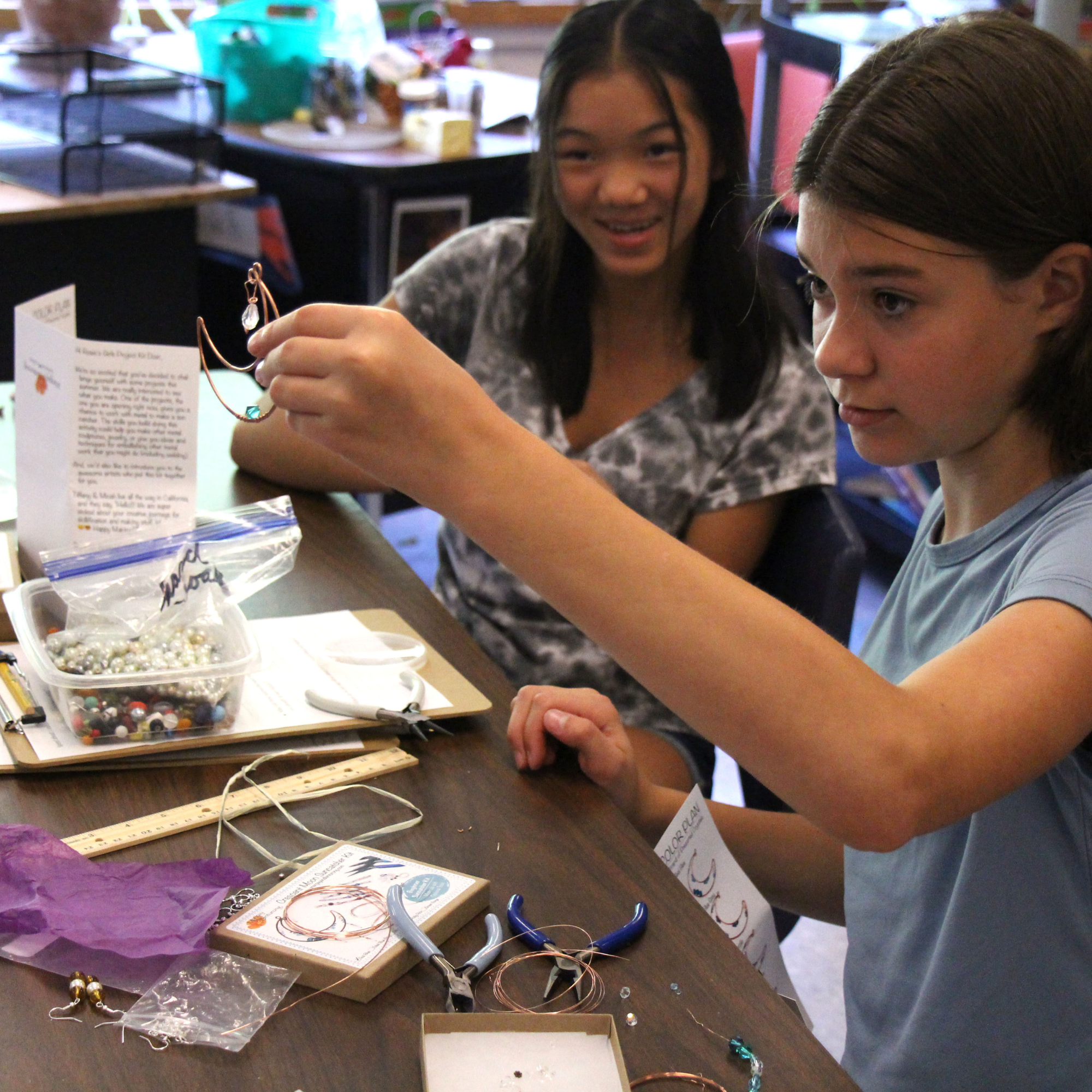 Middle school girls create windchimes during Rosie's Girls Afterschool.