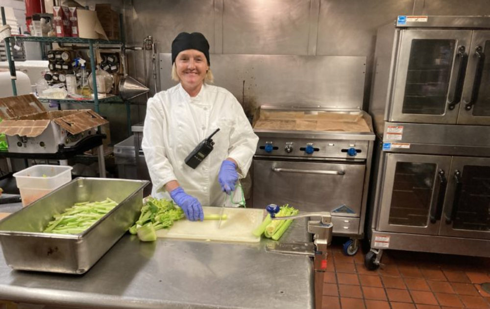 Heather poses while curring vegetables before teaching a cooking class for our culinary program at CRCF.