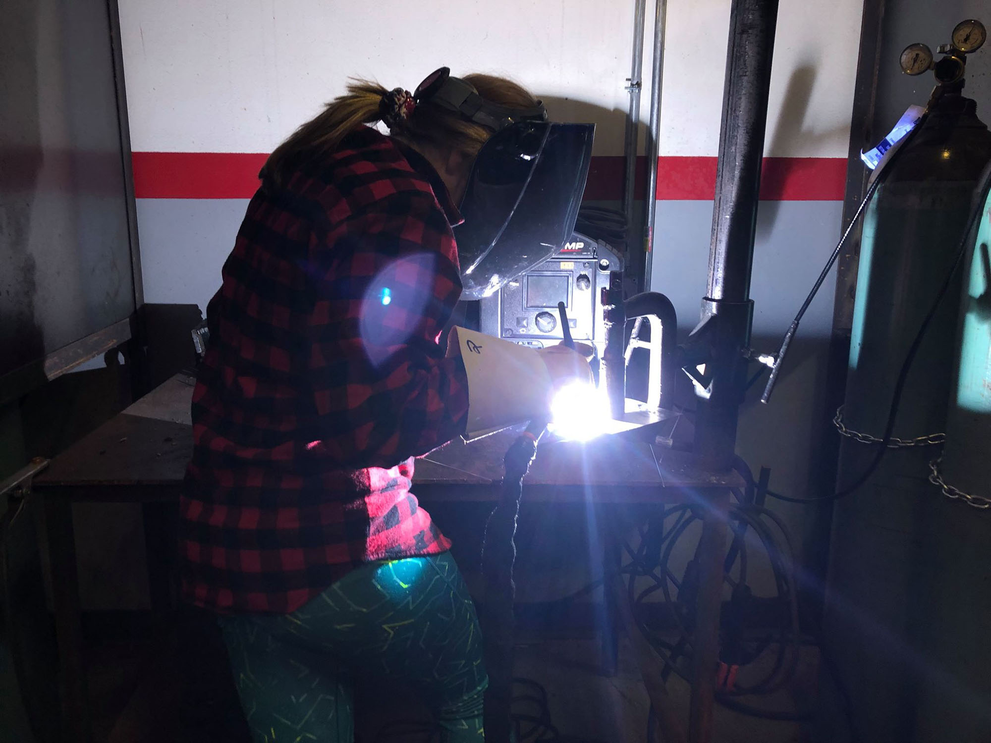 Student tries welding during Rosie’s Girls afterschool program.
