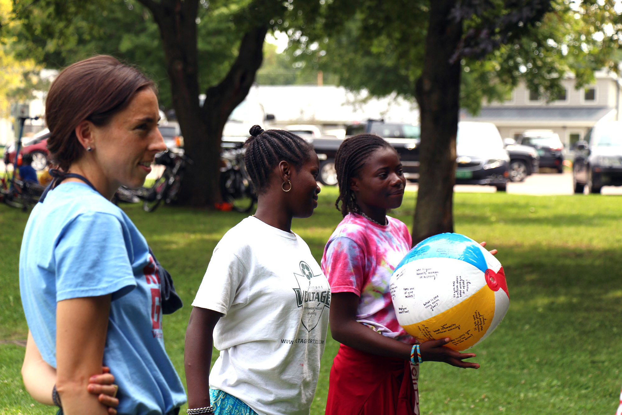 Campers hold beach volleyball during a getting-to-know you game at Rosie’s Girls summer camp.