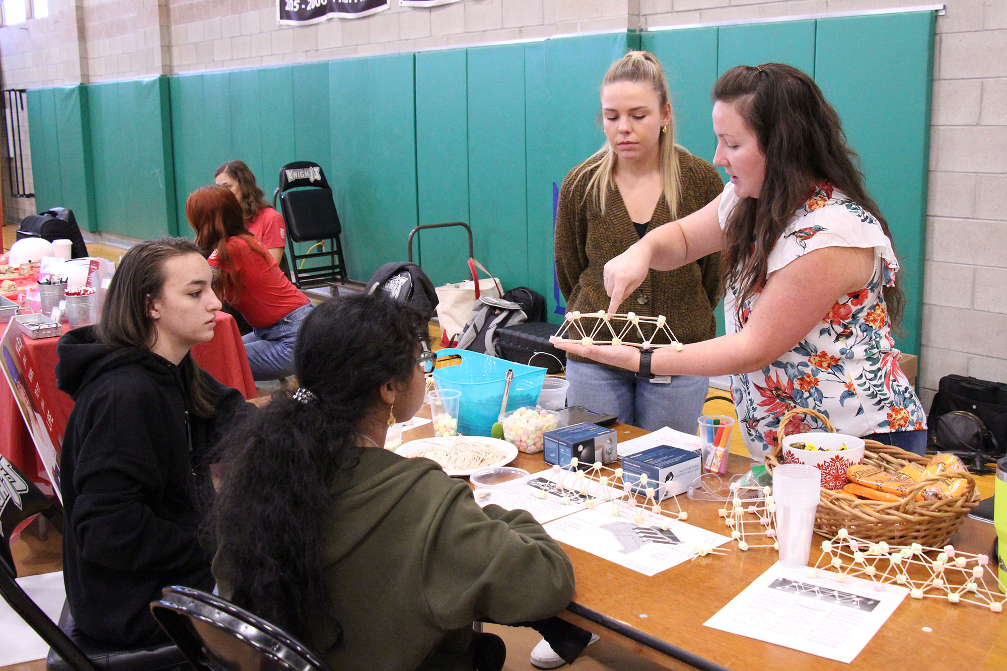 A local employer leads a STEM activity with Vermont high school students at Women Can Do.