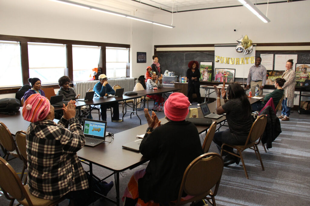 A group of African Refugee and New American women in Vermont gather to celebrate the completion of their digital literacy course. 