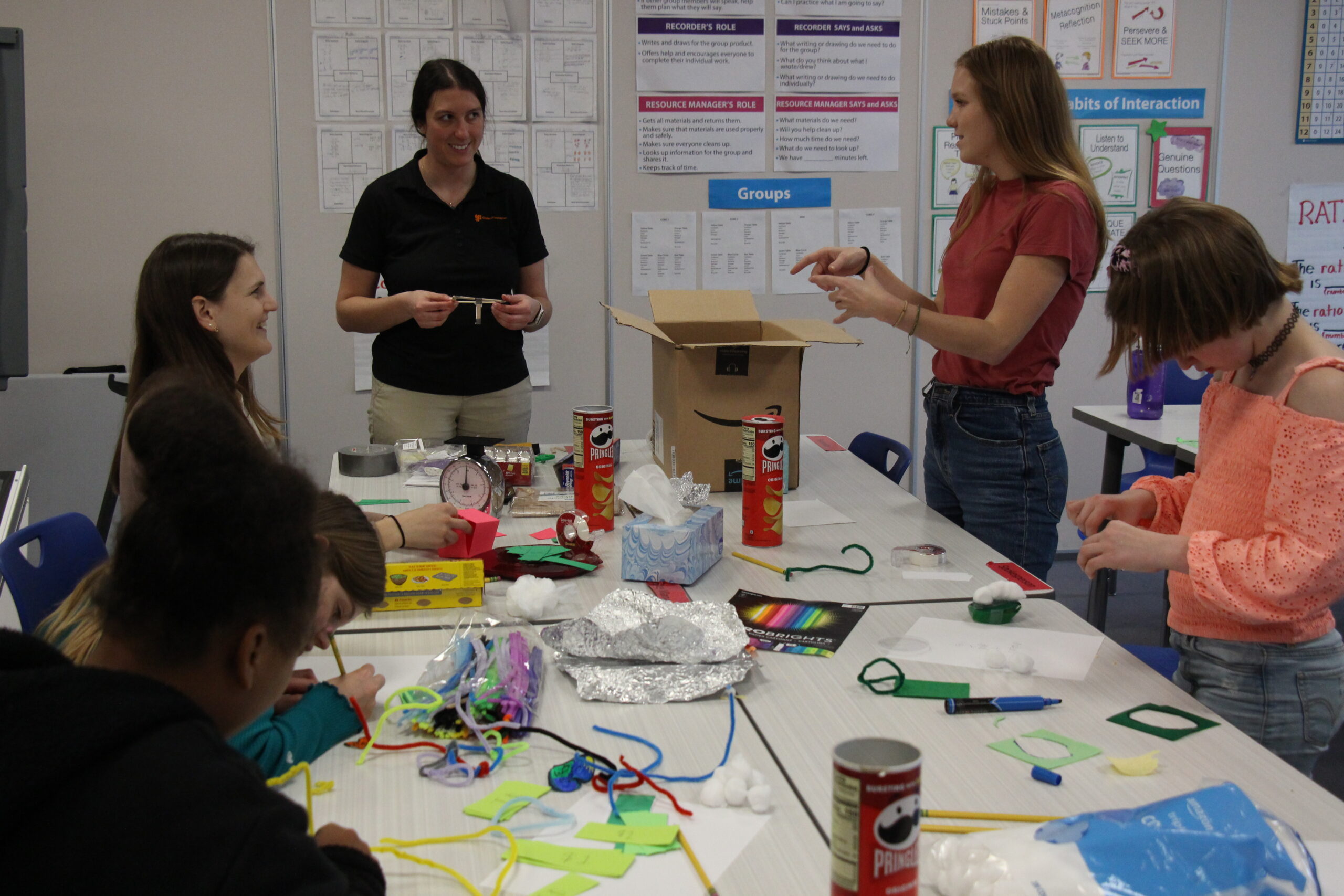 A team from GlobalFoundries leads a STEM activity at Rosie's Girls Afterschool in Winooski.