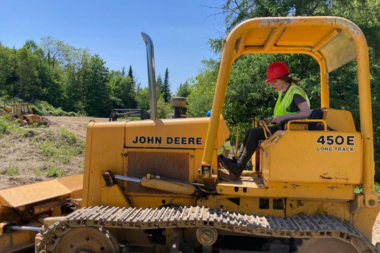 A Trailblazer operates a bulldozer 