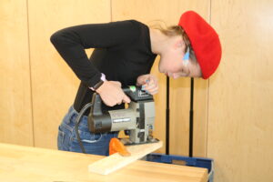 Student uses handsaw