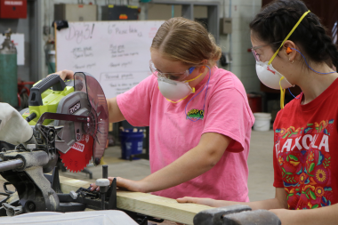 LIFT Participant uses a chop saw