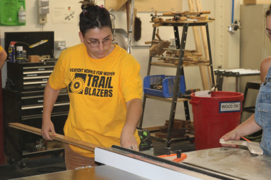 Trailblazer uses a table saw to cut trim board