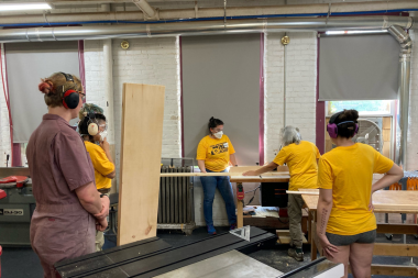 Trailblazers build shelves using a table saw