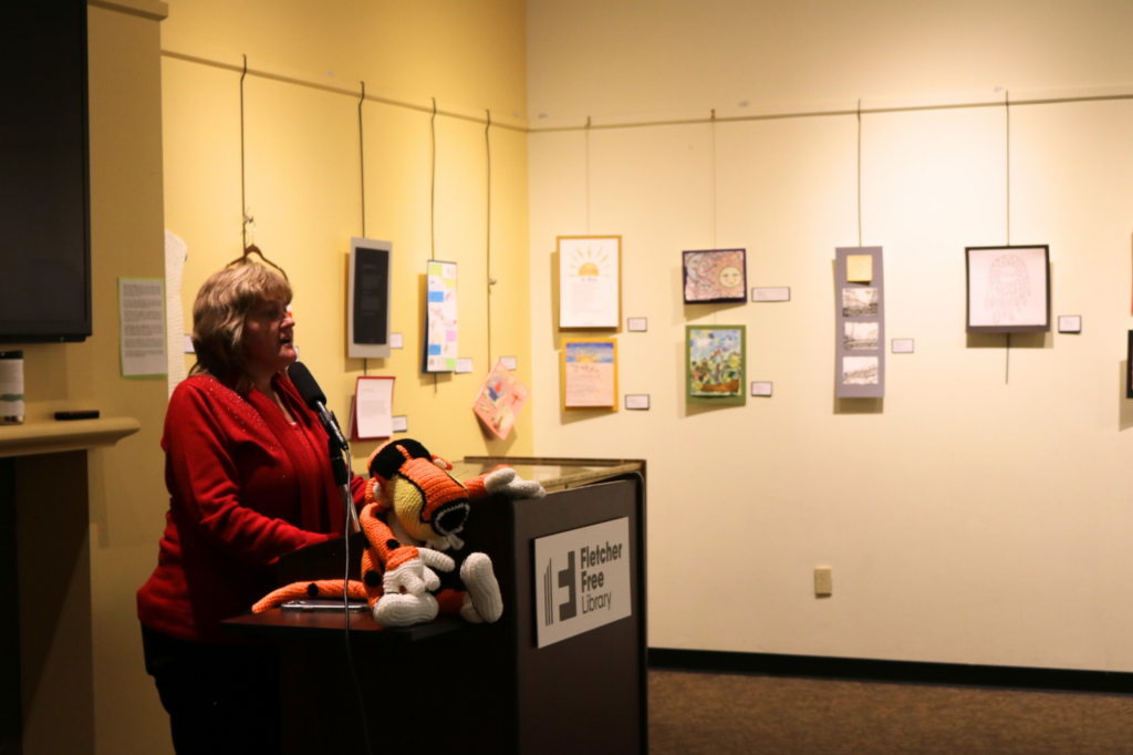 Heather Newcomb speaks at Finding Hope Within exhibit event at Fletcher Free Library.