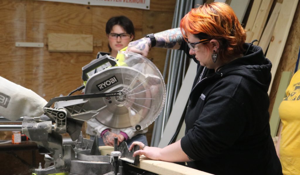 Leigh uses a miter saw during the Trailblazers trades training program