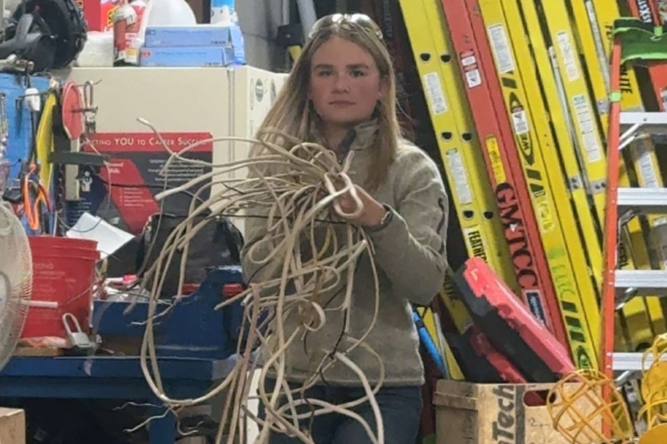 Leah holds a bundle of wires