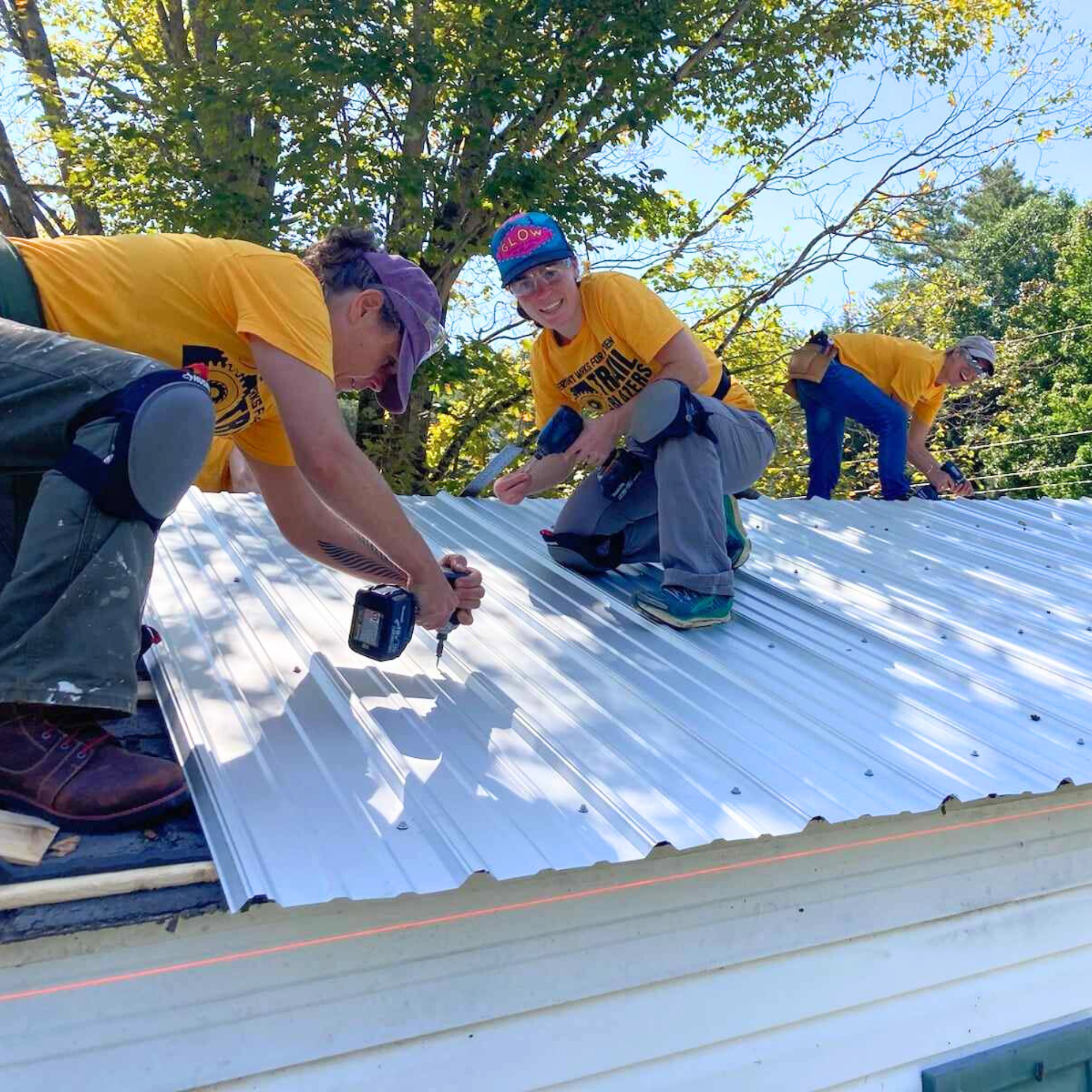 Trailblazers participants worked with COVER Home Repair to help repair a community member's roof.