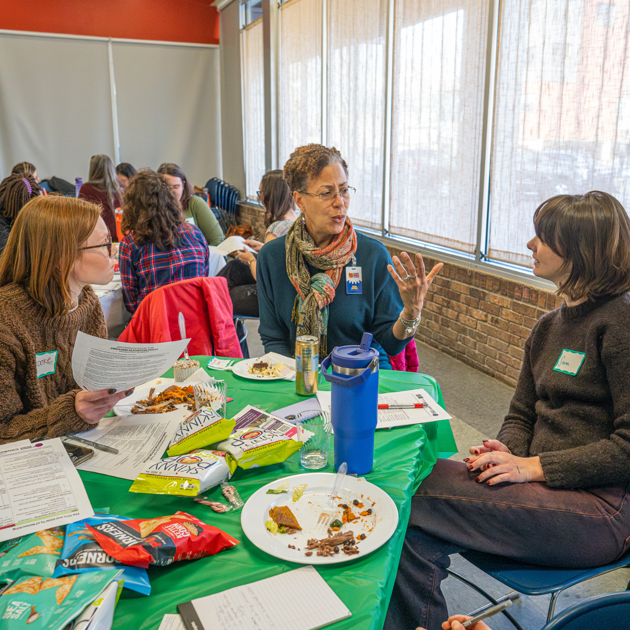 Paige works with participants at an event to help them craft elevator pitches