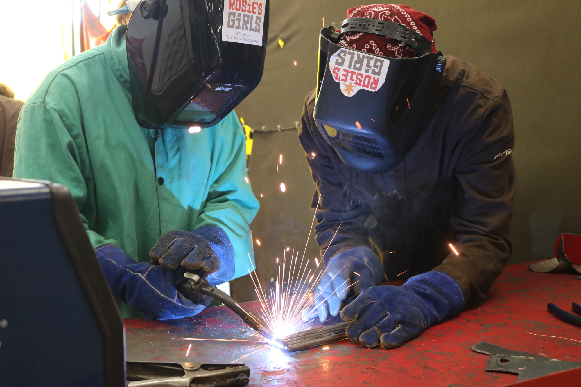 Rosie's Girls WELD camper uses a plasma cutter at summer camp.