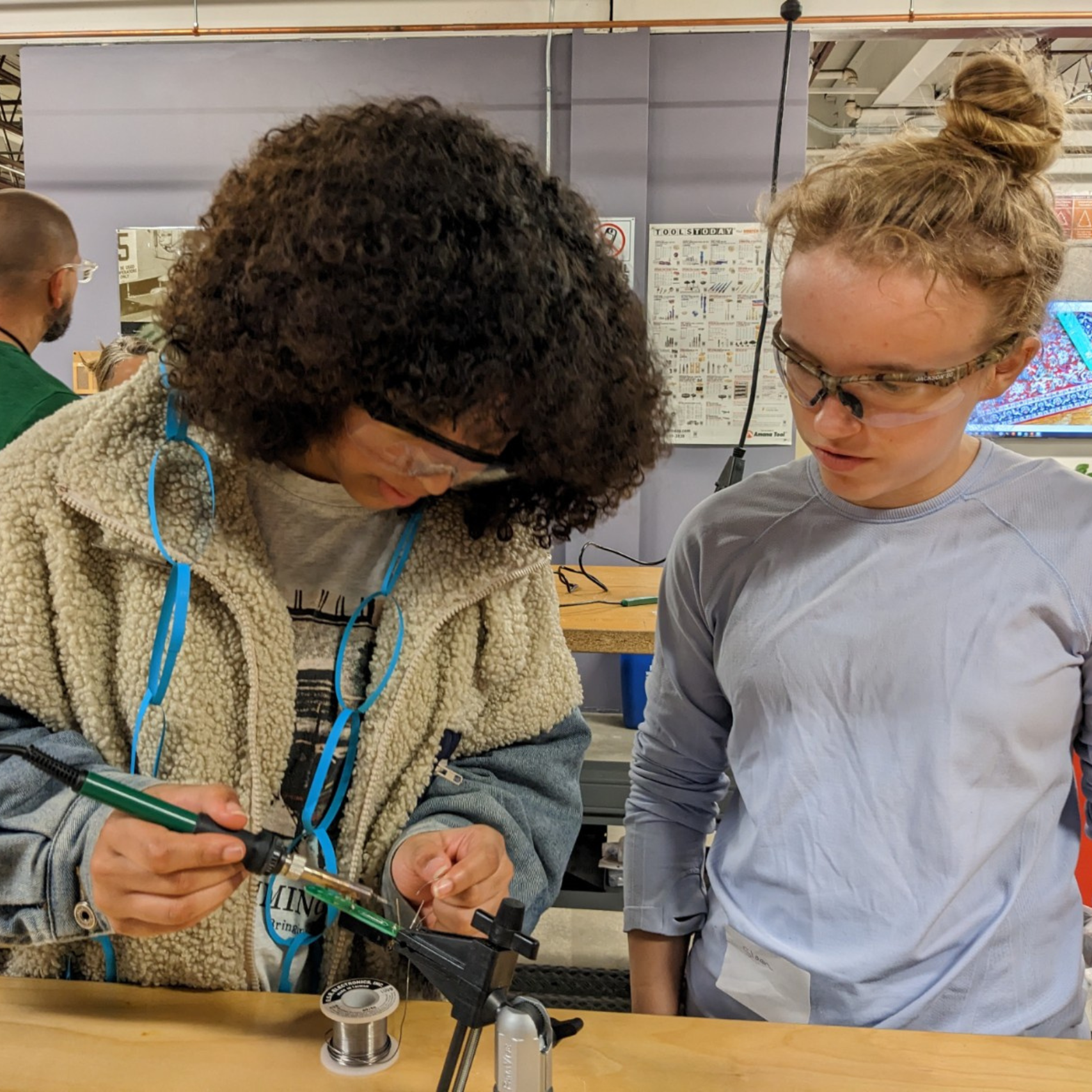 Middle School students try soldering at Career Challenge Day