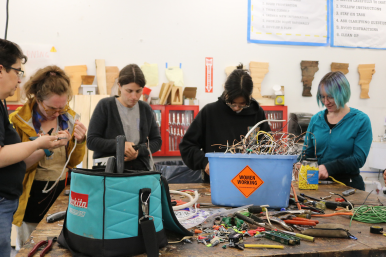 Trailblazers repair power cords during electrical instruction
