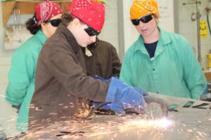 LIFT campers using plasma cutter