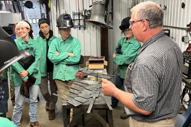 Joe Depatie shows Trailblazers how to weld
