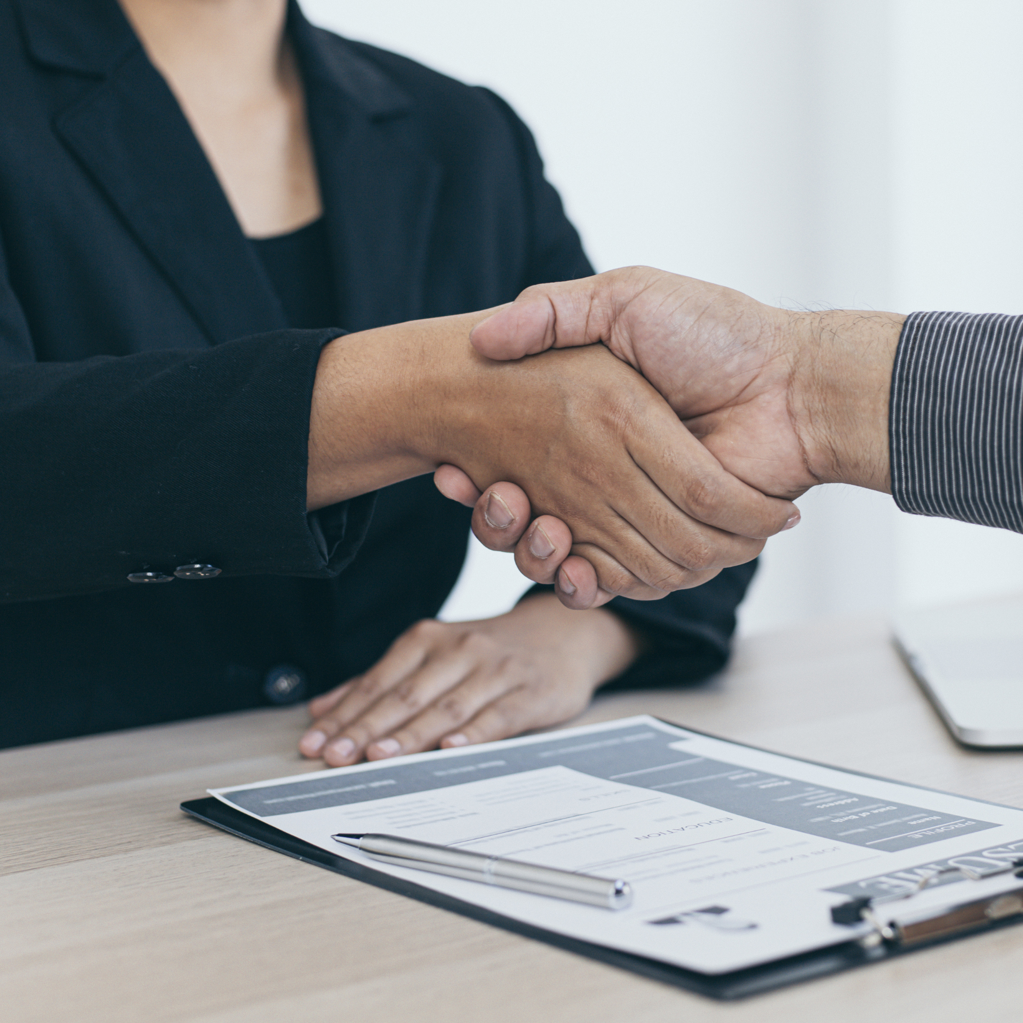 Employer welcomes a new employee with a handshake