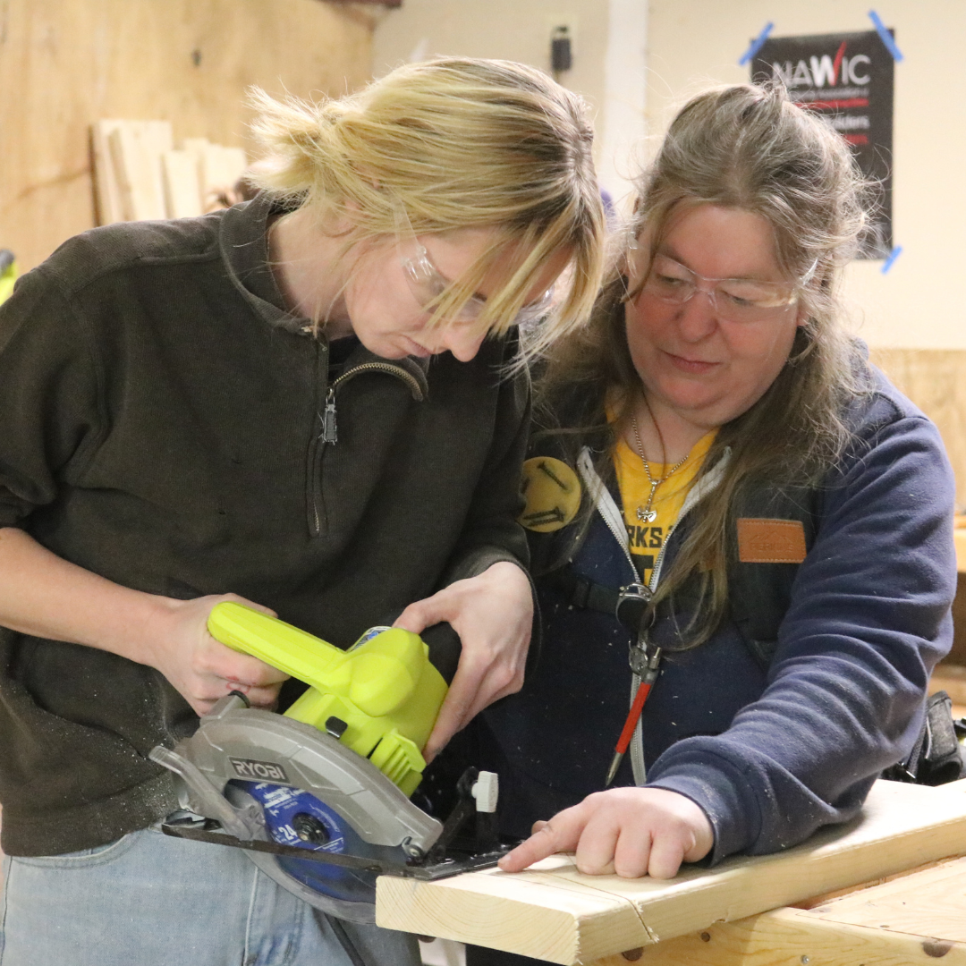 Trailblazer uses a hand saw with the guidance of an instructor