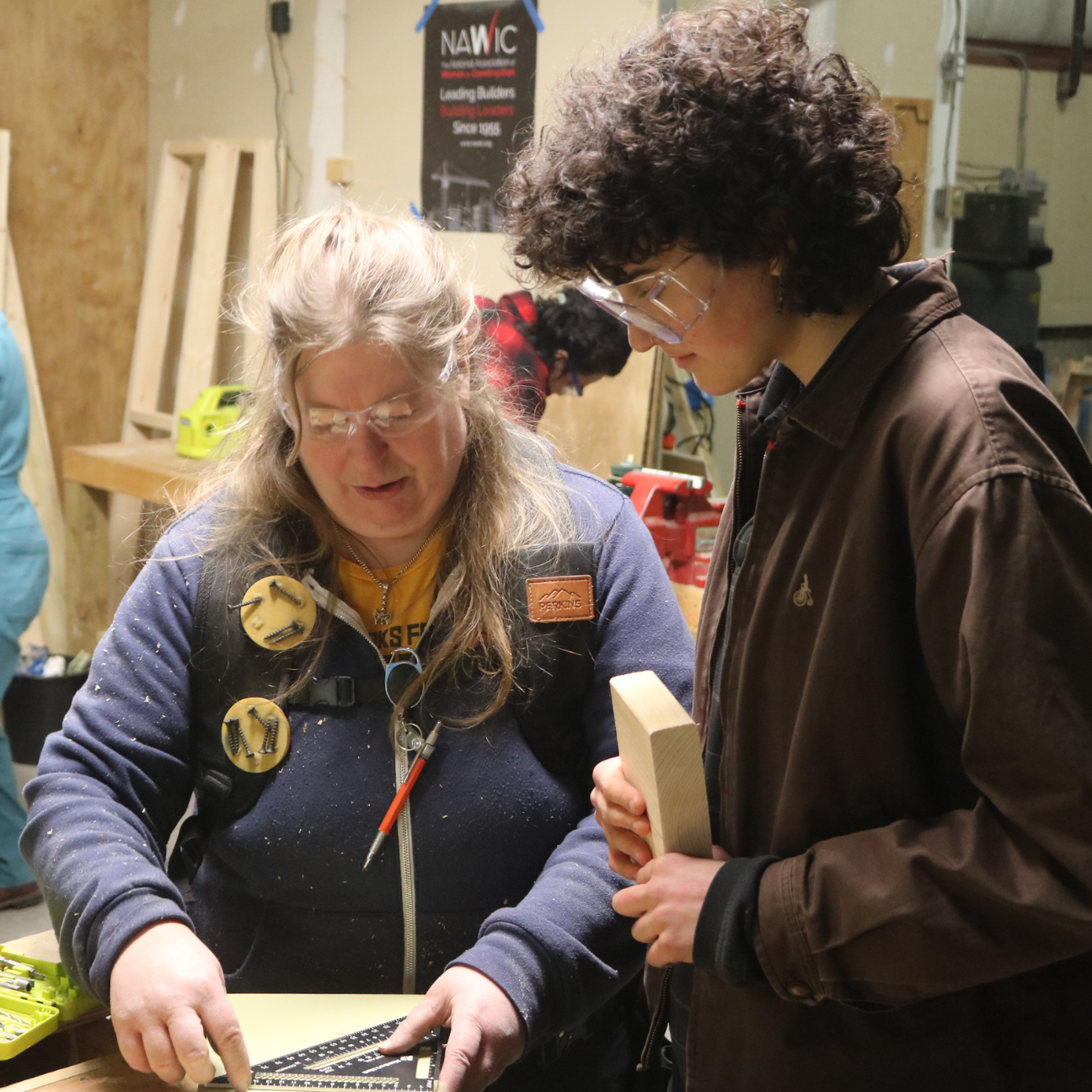 Trailblazers instructor shows a participant how to use a speed square