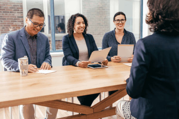 Panel of interviewers conduct a hiring interview