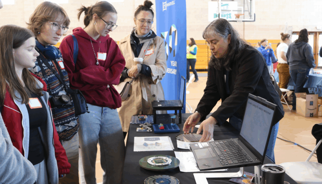 Students explore technology at a table at Women Can Do