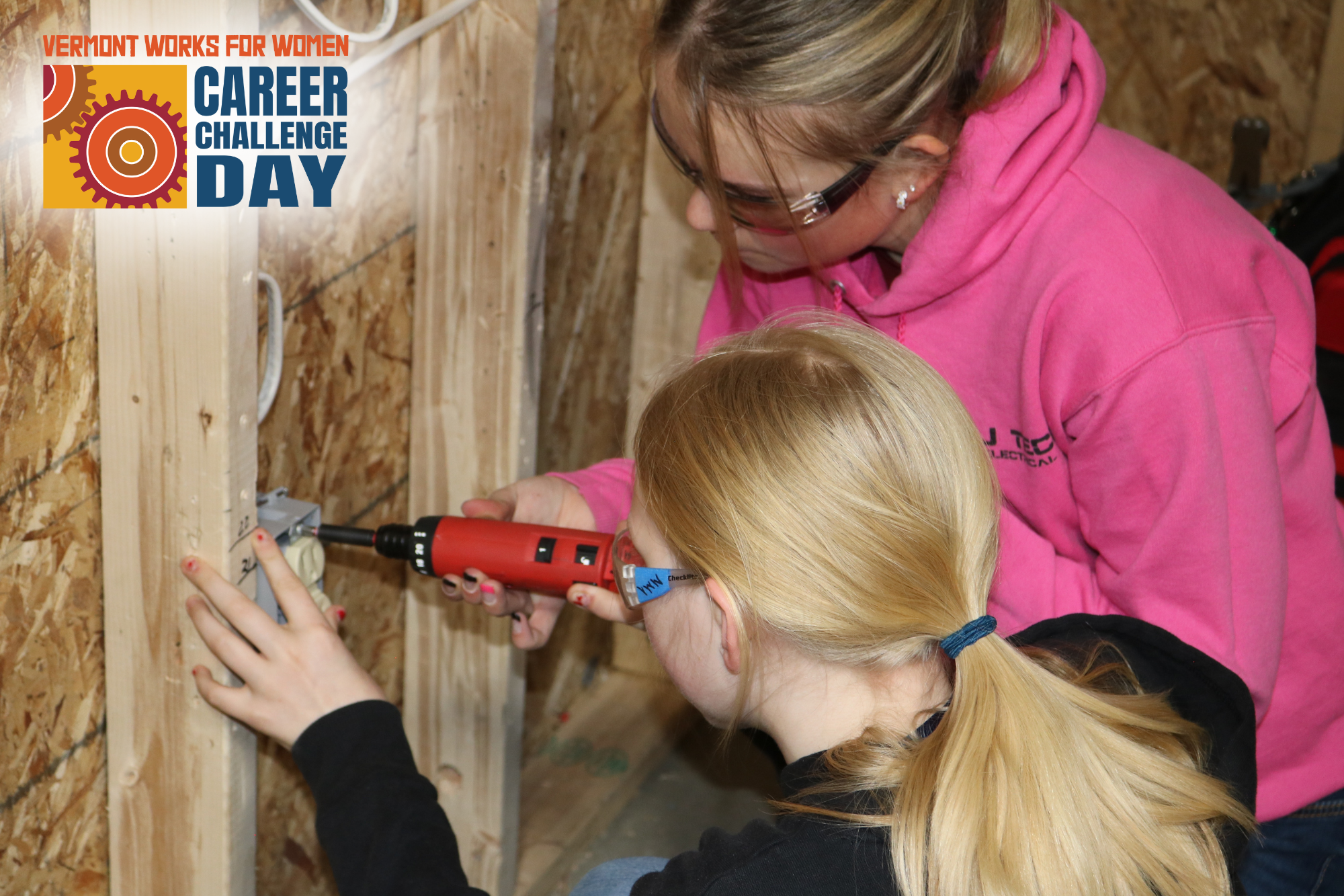 A GMTCC student shows a middle school girl how to wire an outlet at Career Challenge Day