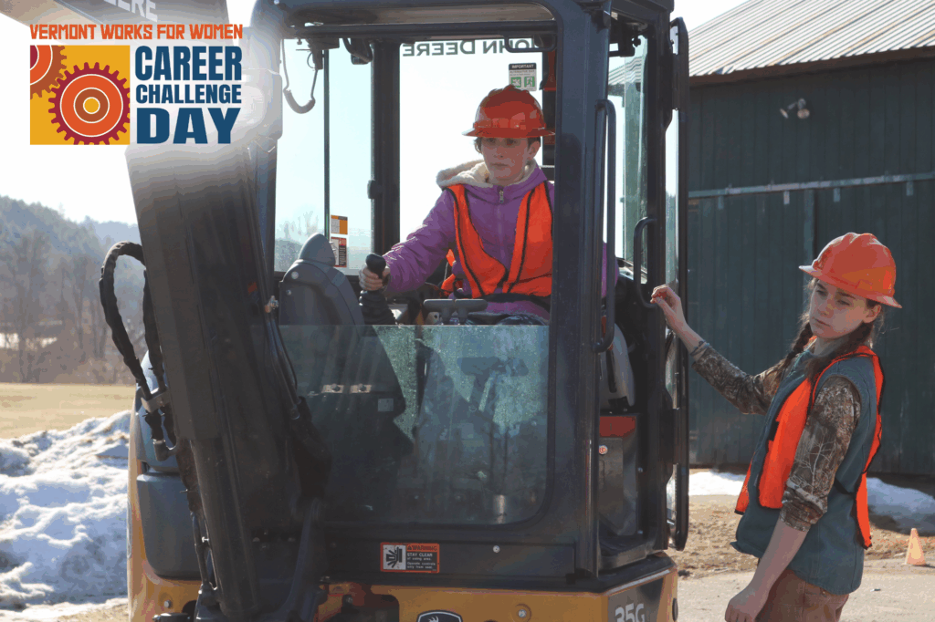 At Career Challenge Day at RTCC, a tech center student shows a middle schooler how to use a backhoe