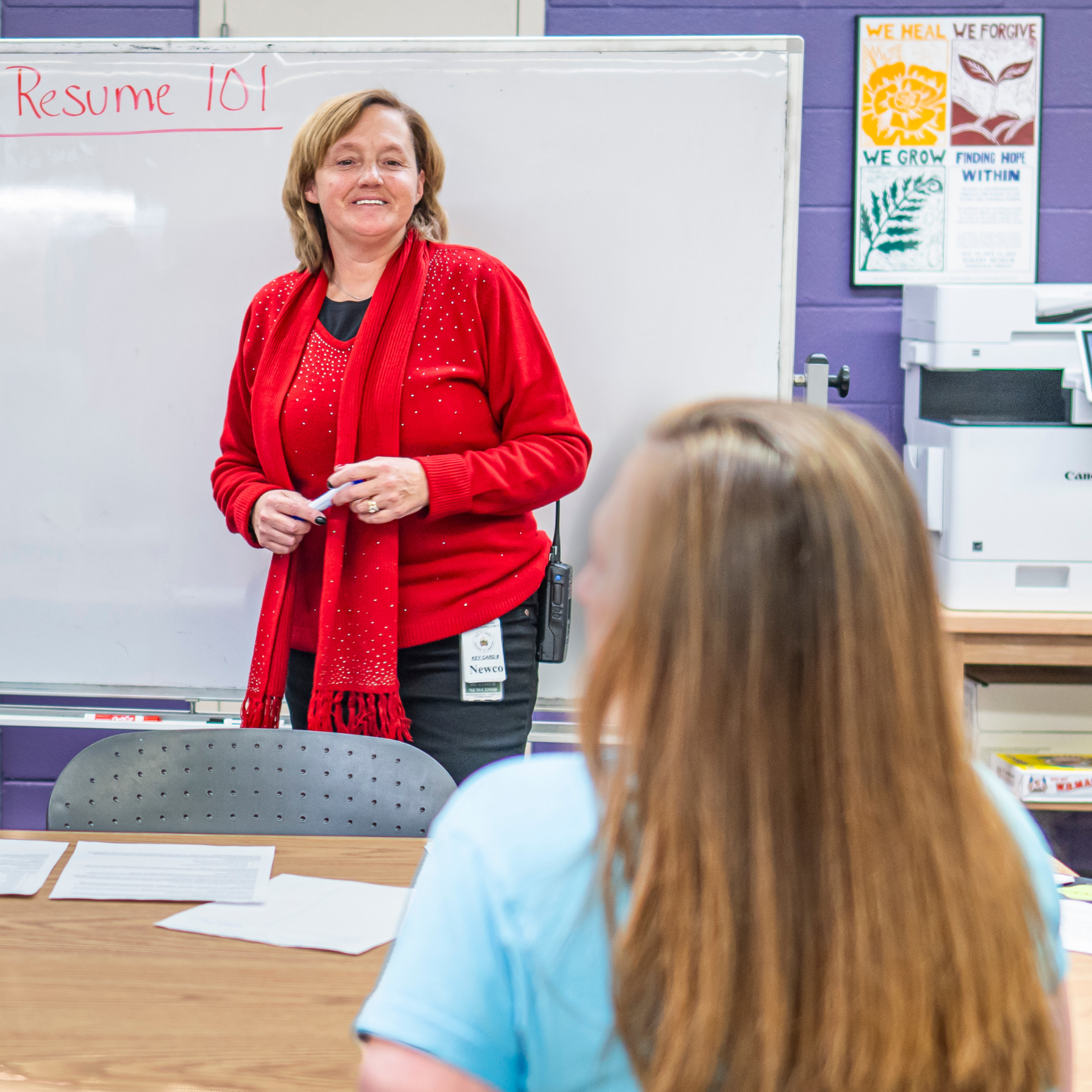 A VWW staff member works in facility on resume skills with an incarcerated woman