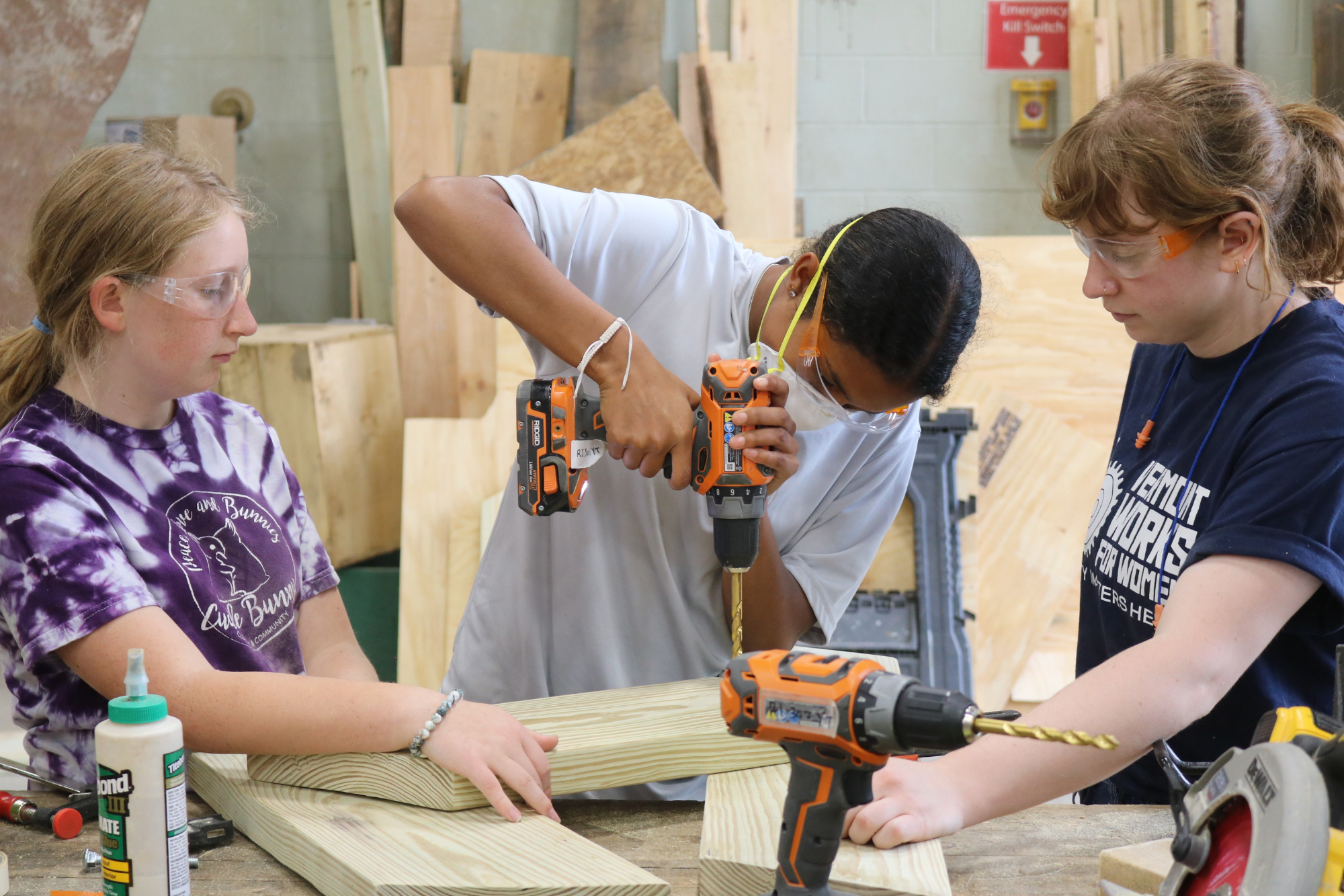 A high school students uses a drill during LIFT, a week long trades program for high school students