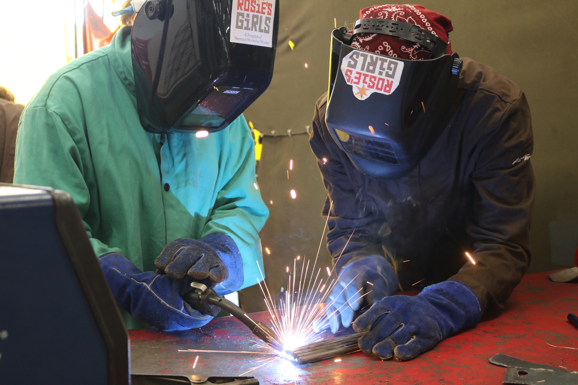 Rosie's Girls WELD campers use a plasma cutter at summer camp.