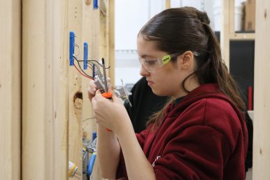 Student wires an electrical plug at Career Challenge Day at RTCC