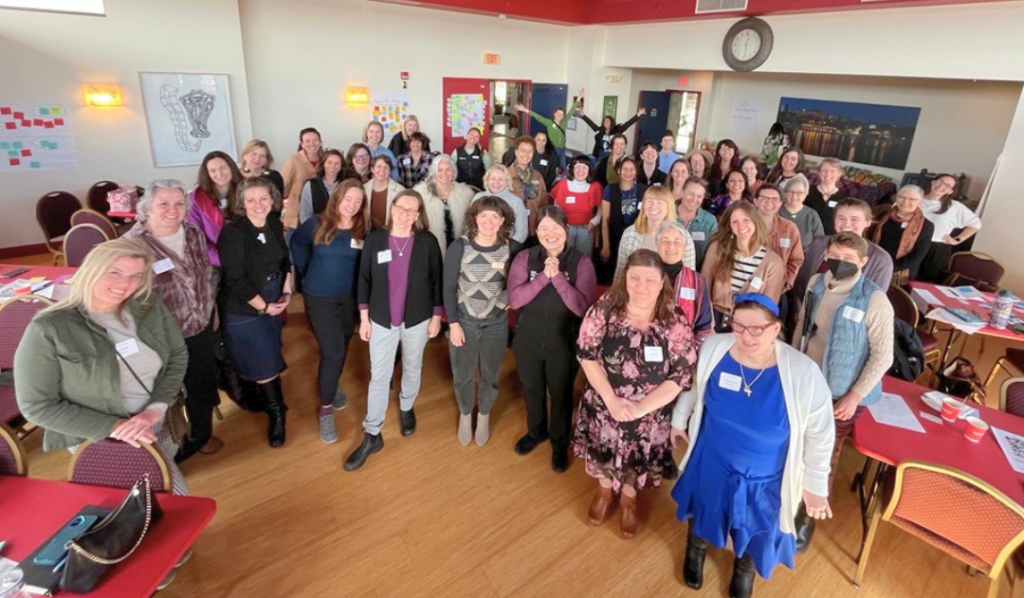 Participants pose for a group photo at Business Through the Looking Glass event
