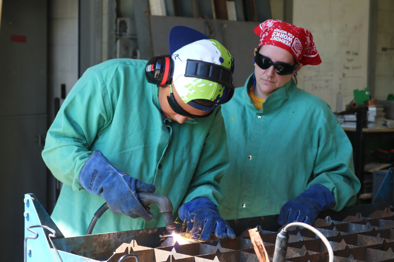 LIFT participant uses a plasma cutter to cut metal shapes