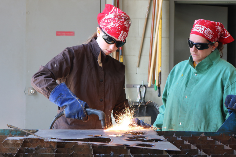 LIFT participant uses a plasma cutter to cut metal shapes