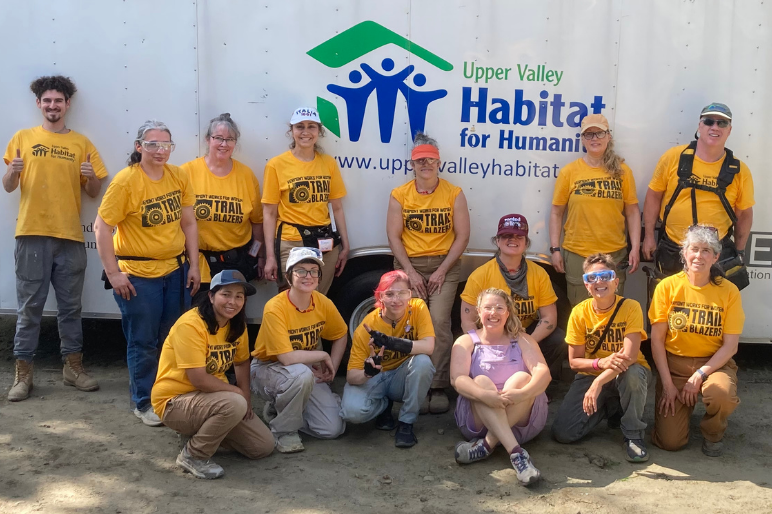 Trailblazers pose in front of an Upper Valley Habitat for Humanity truck after a volunteer day
