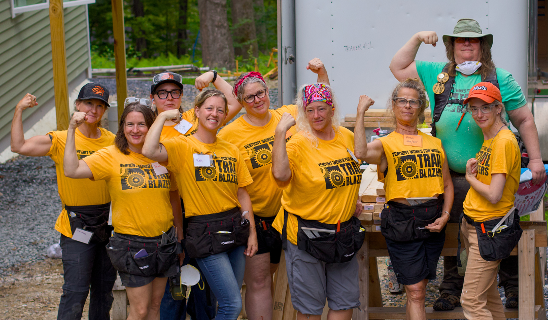 Manchester Trailblazers flex their muscles in a group photo at Habitat for Humanity
