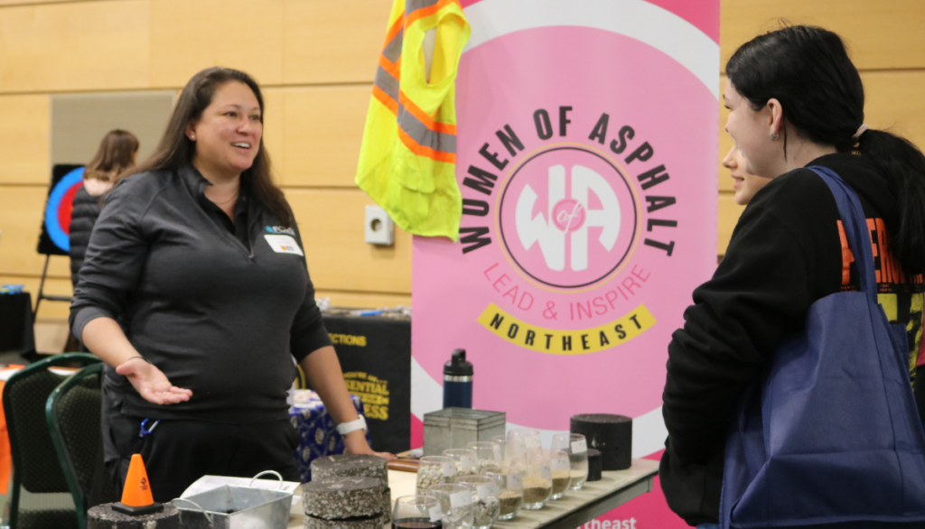 Student talks with Women of Asphalt at Women Can Do Resource Hall
